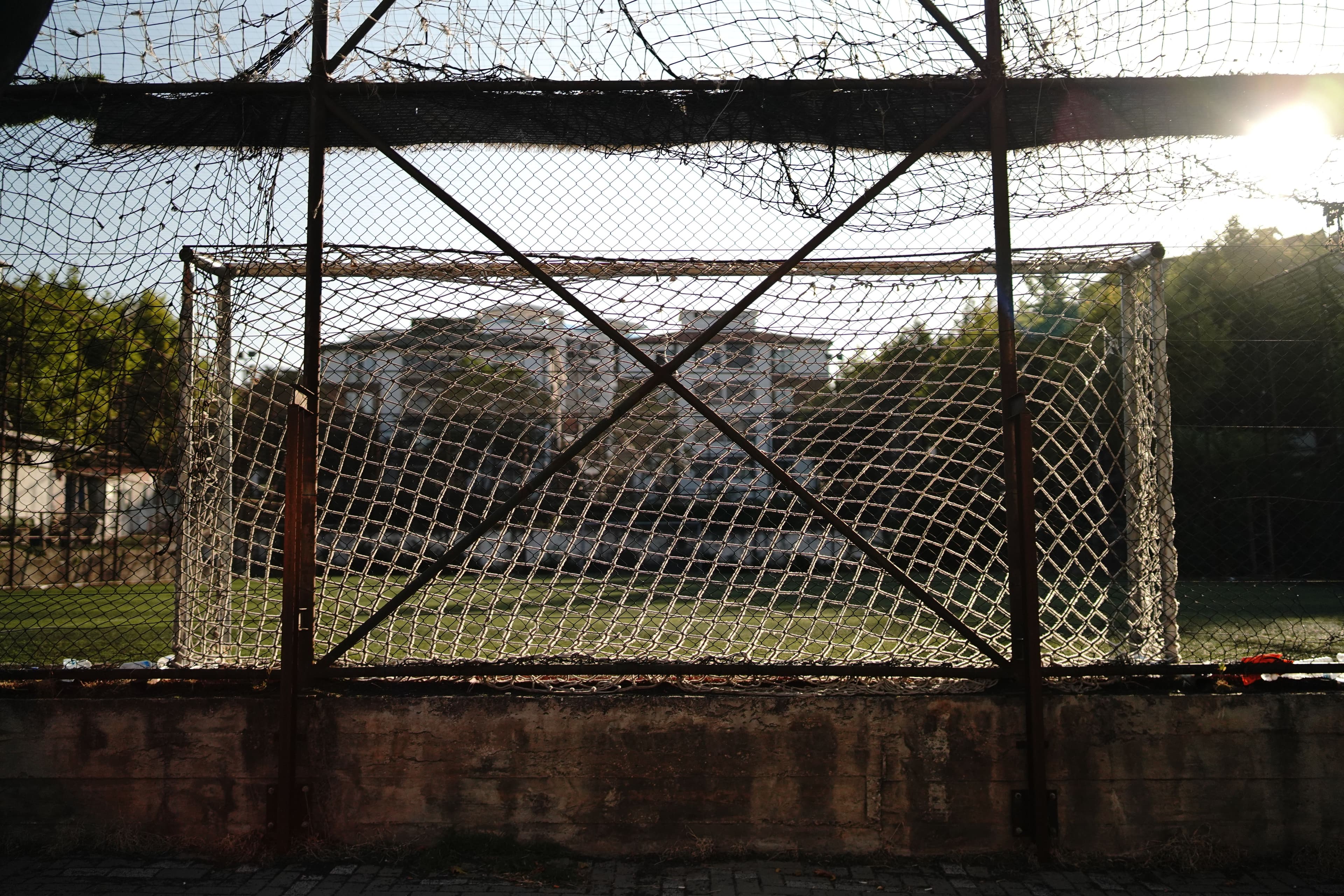 Rustic football goal under afternoon sun