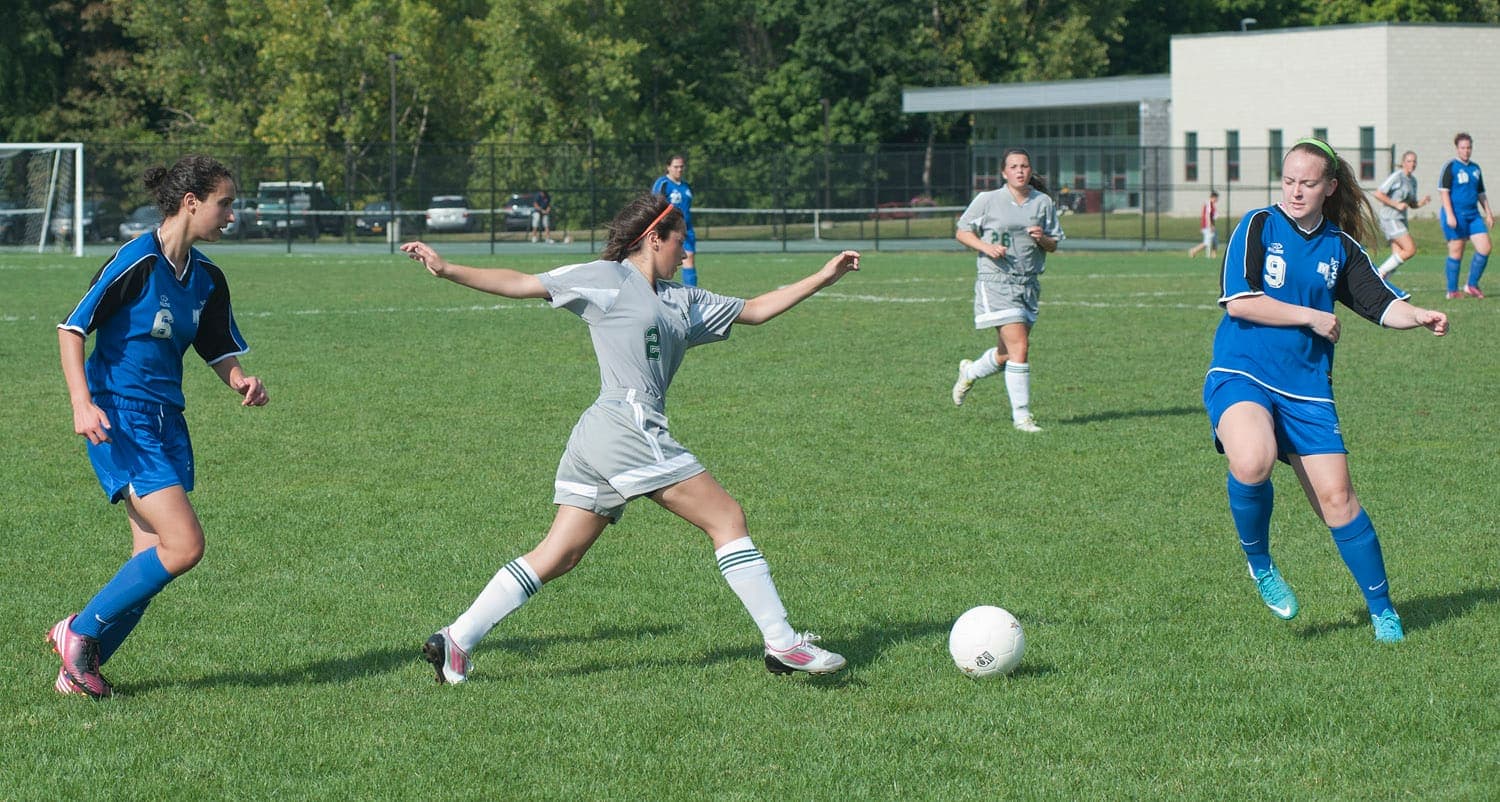 Women’s footballers contesting the ball during a match