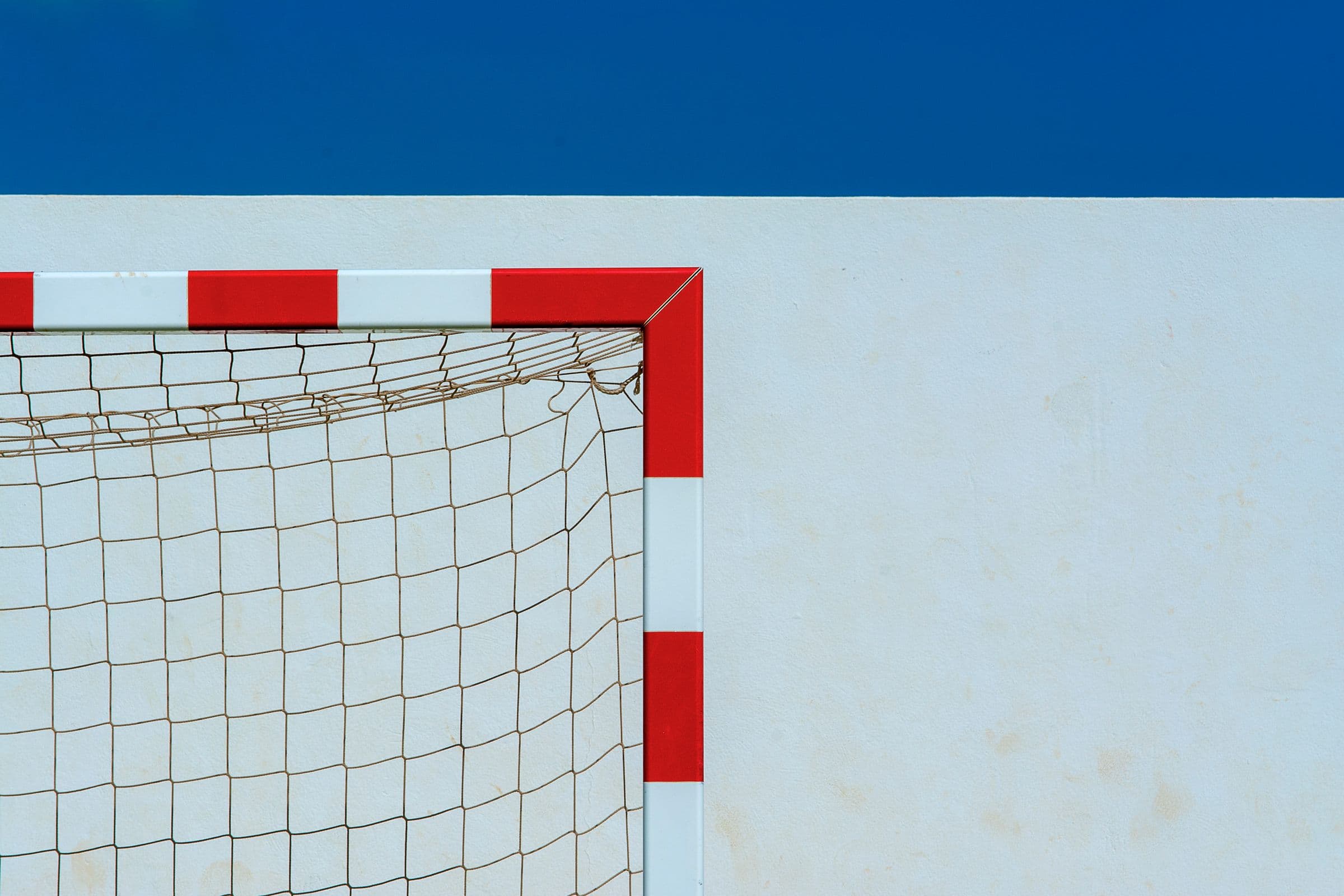 Minimal soccer goal with red and white stripe