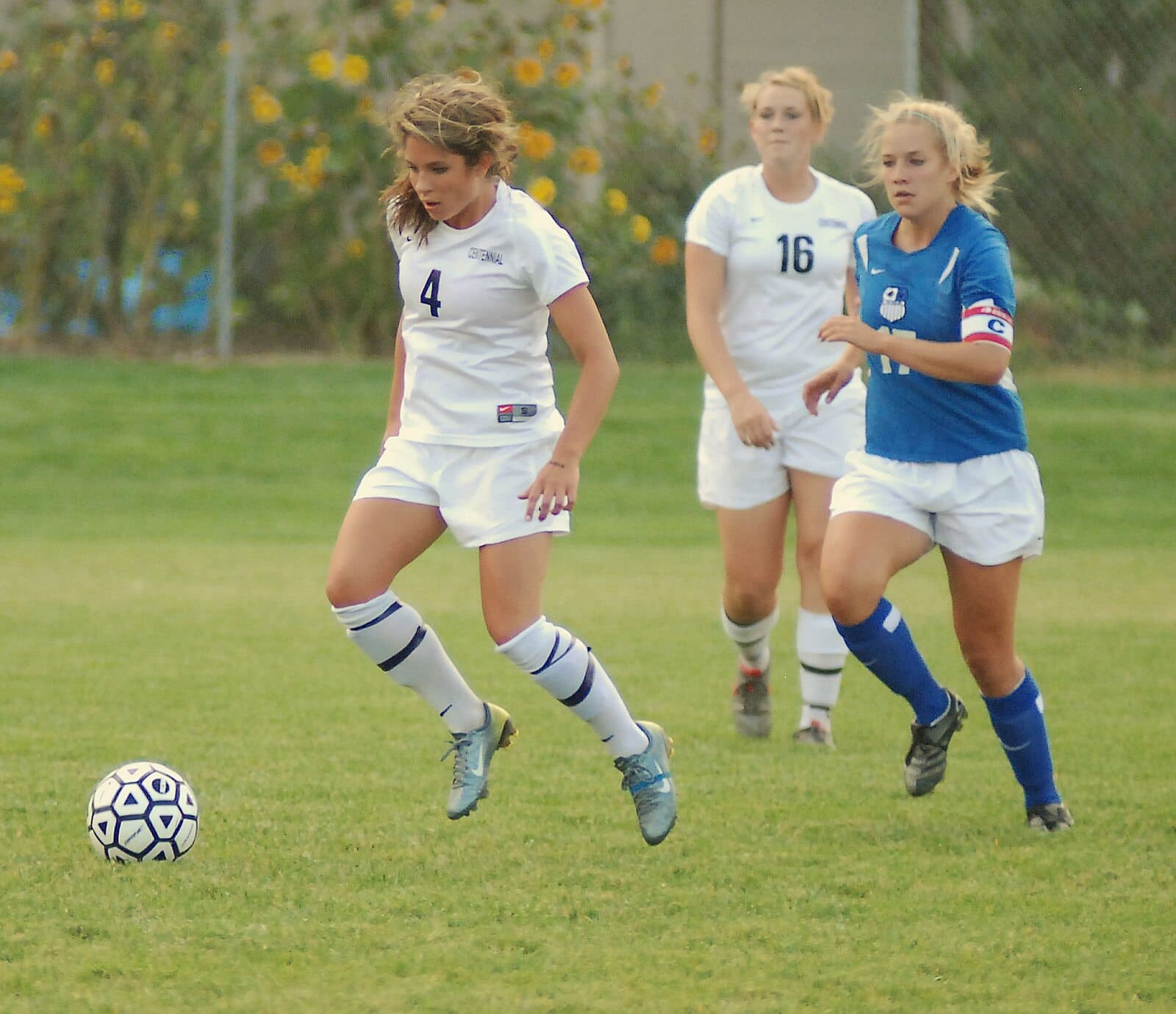 Girls’ football action with players and a ball