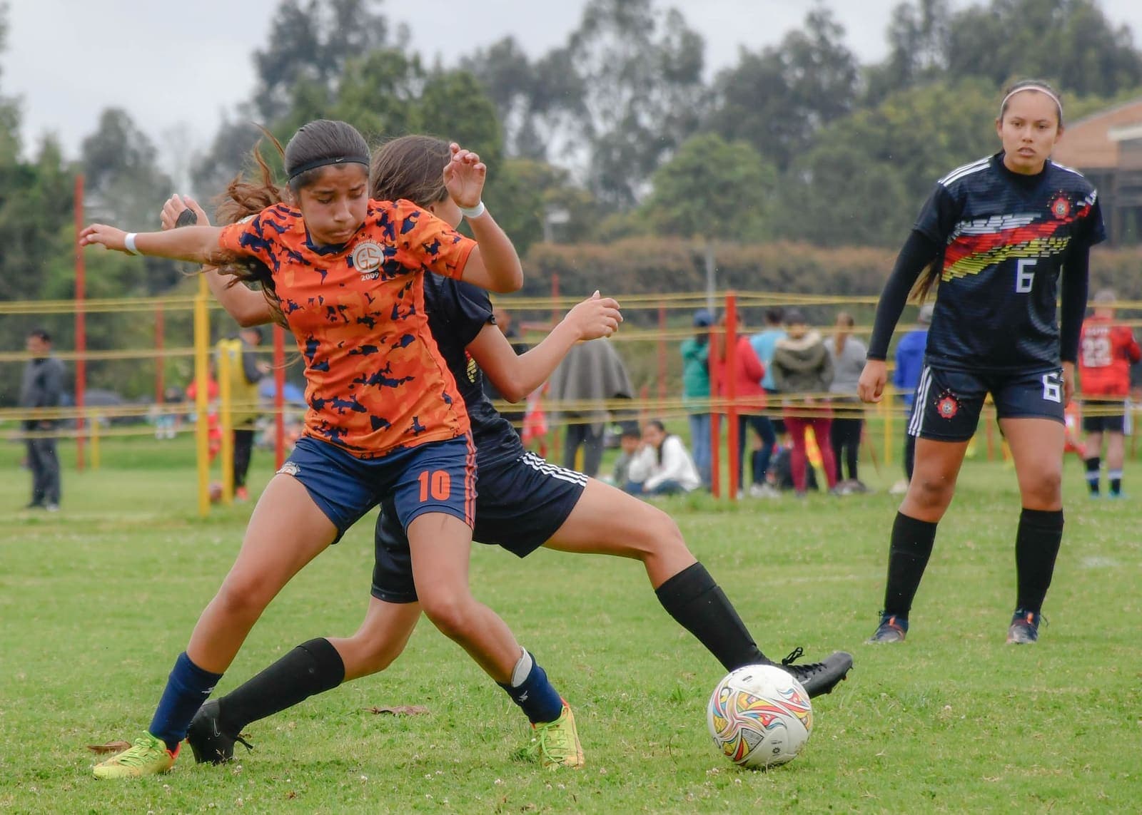 Girls competing in a soccer match