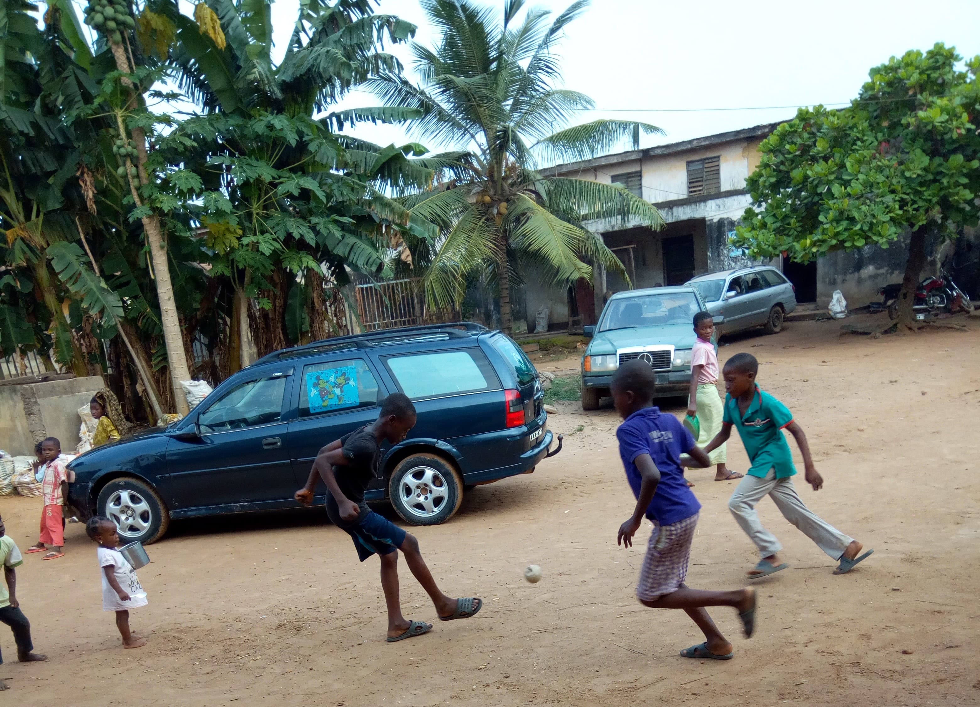 Junior football players training near stadium stands.