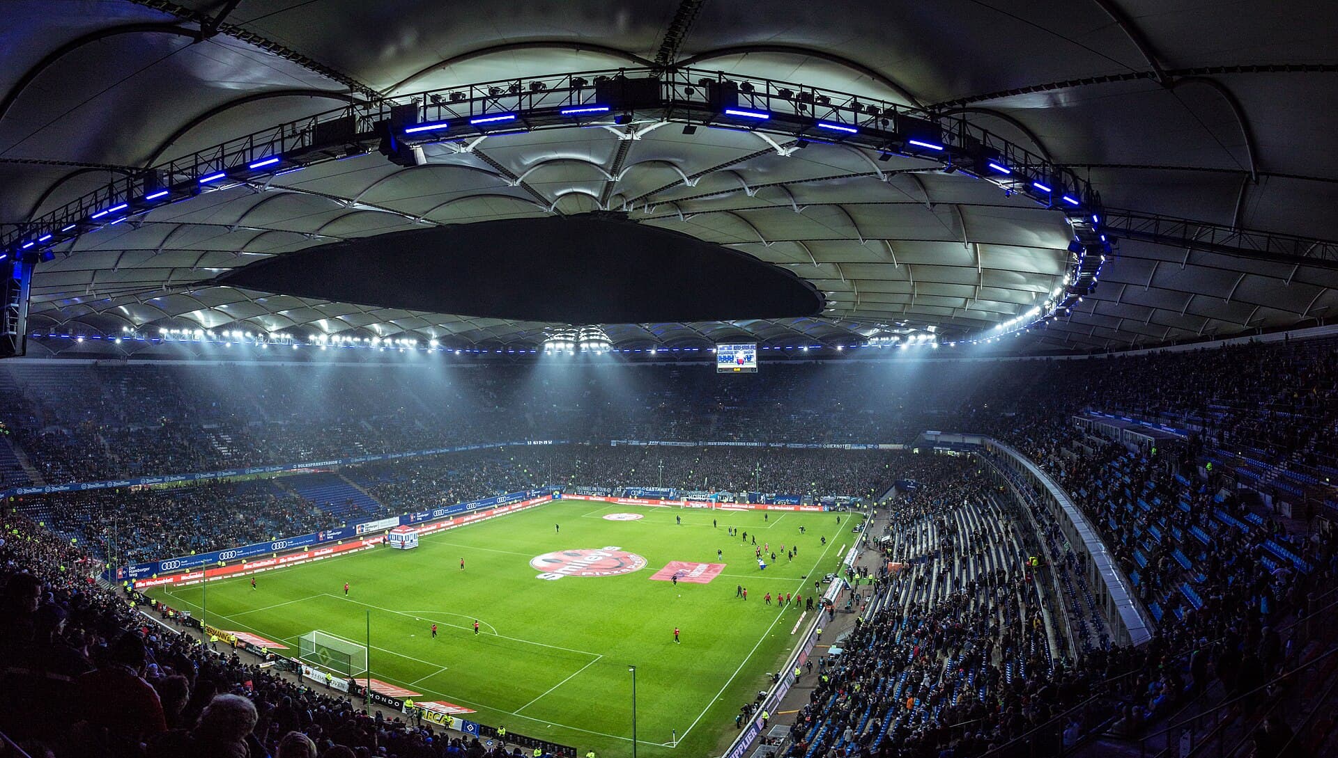 Volksparkstadion Hamburg at night (illustrative)