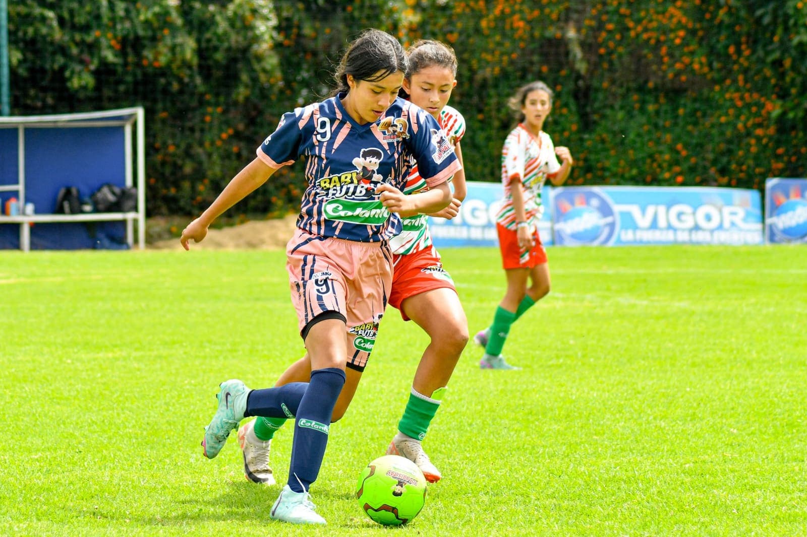Women playing football on a field