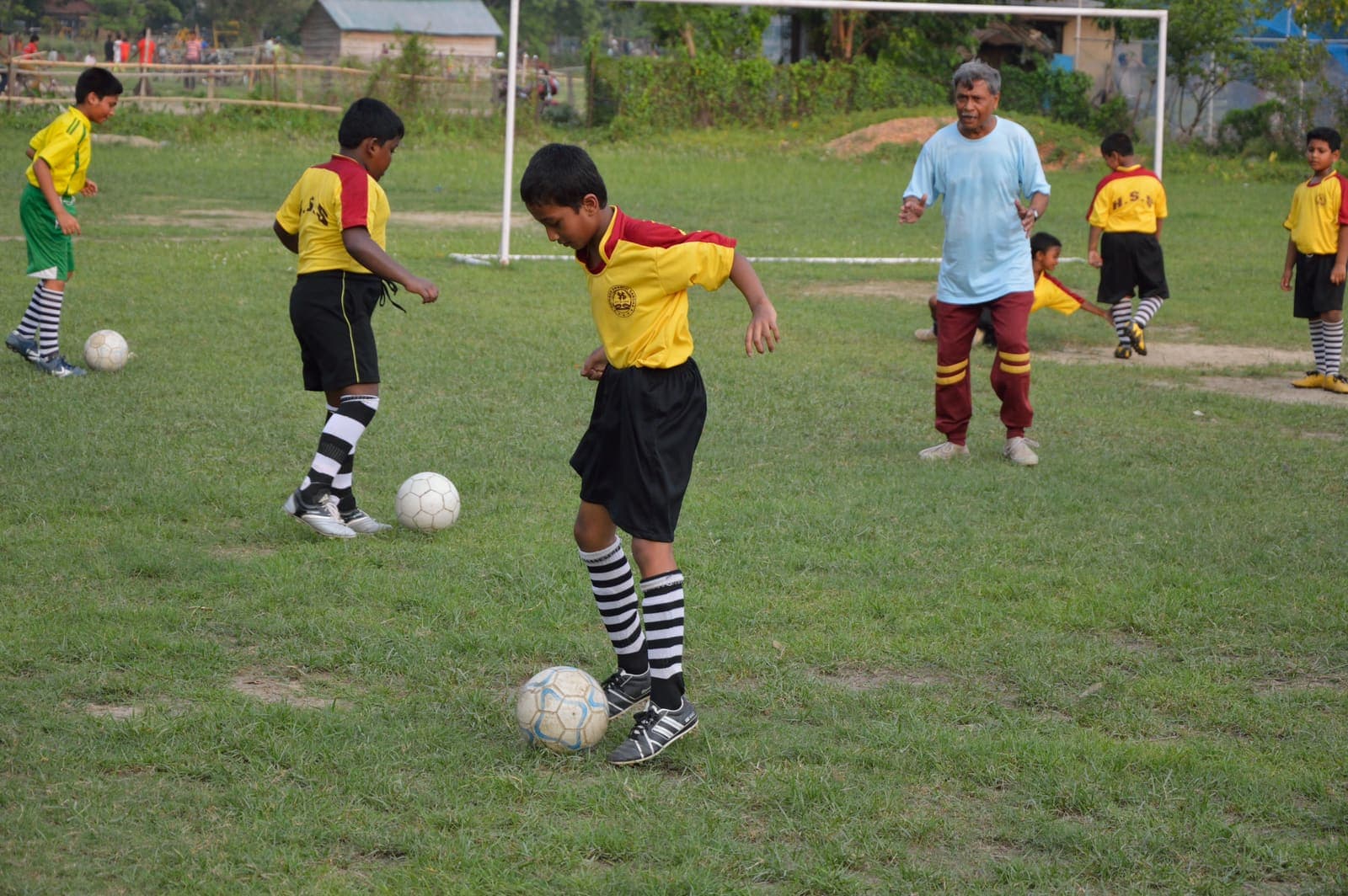 Youth football coaching in Howrah, India with ball visible
