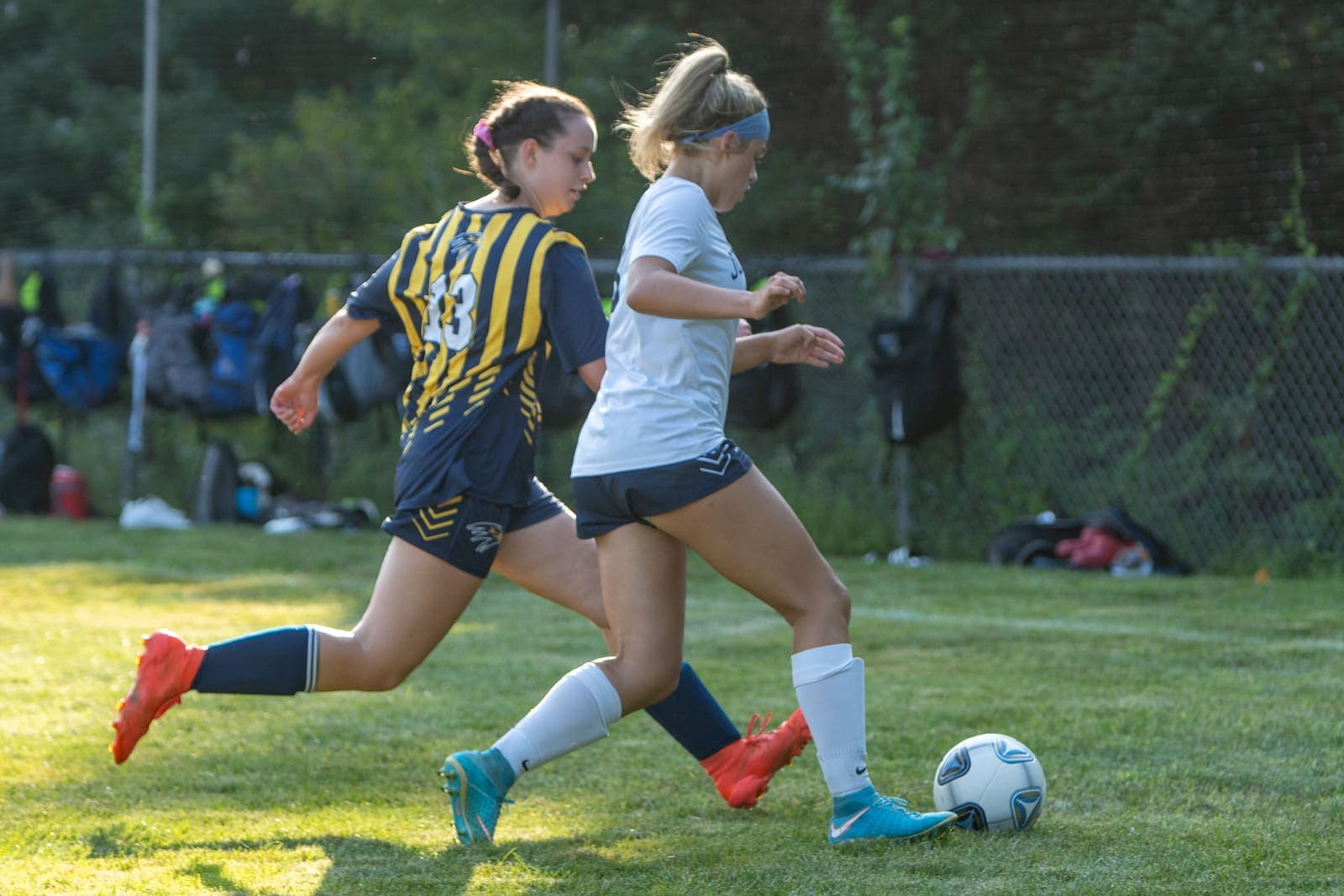 Girls’ football match with ball in play