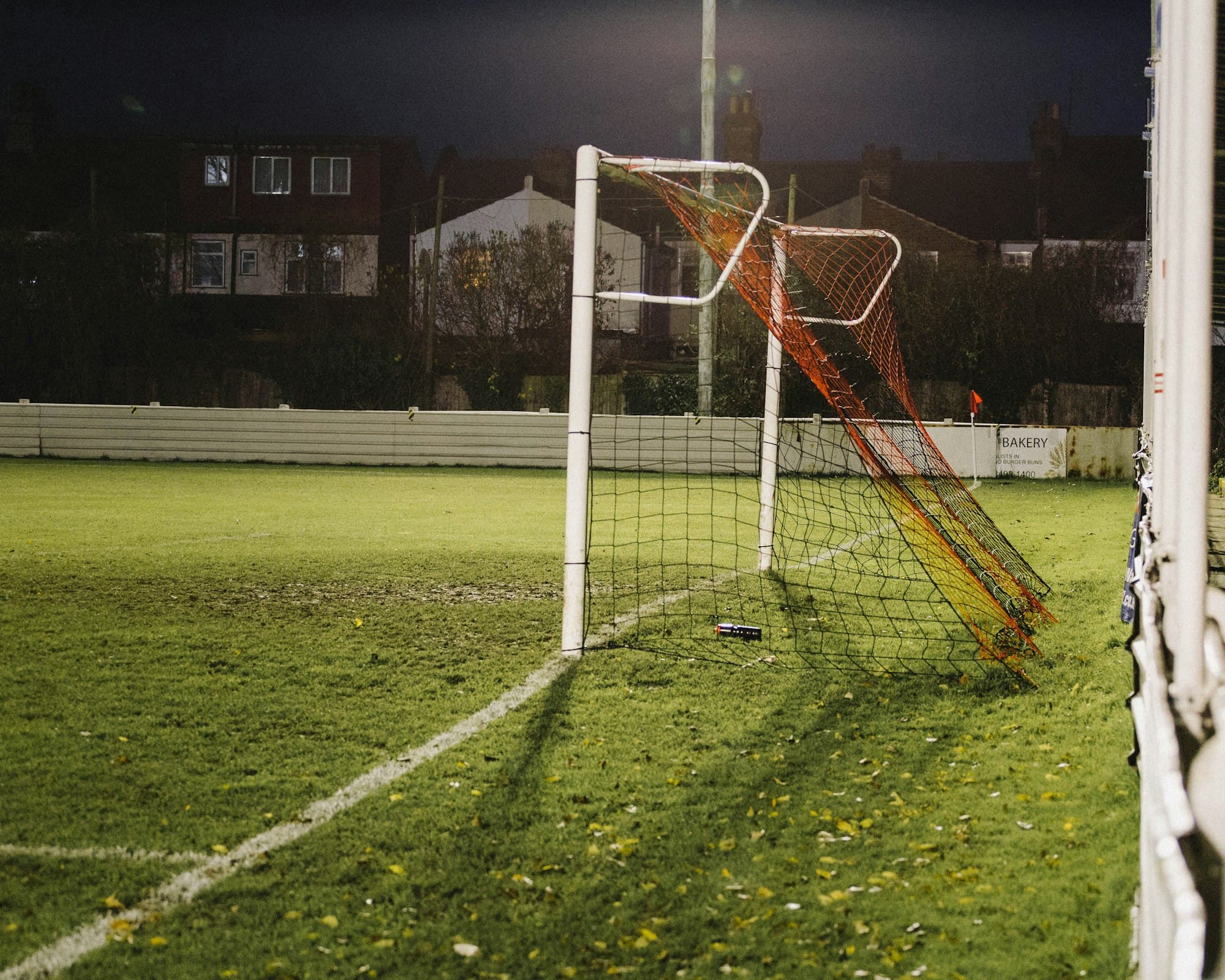 Football goal net on a green pitch