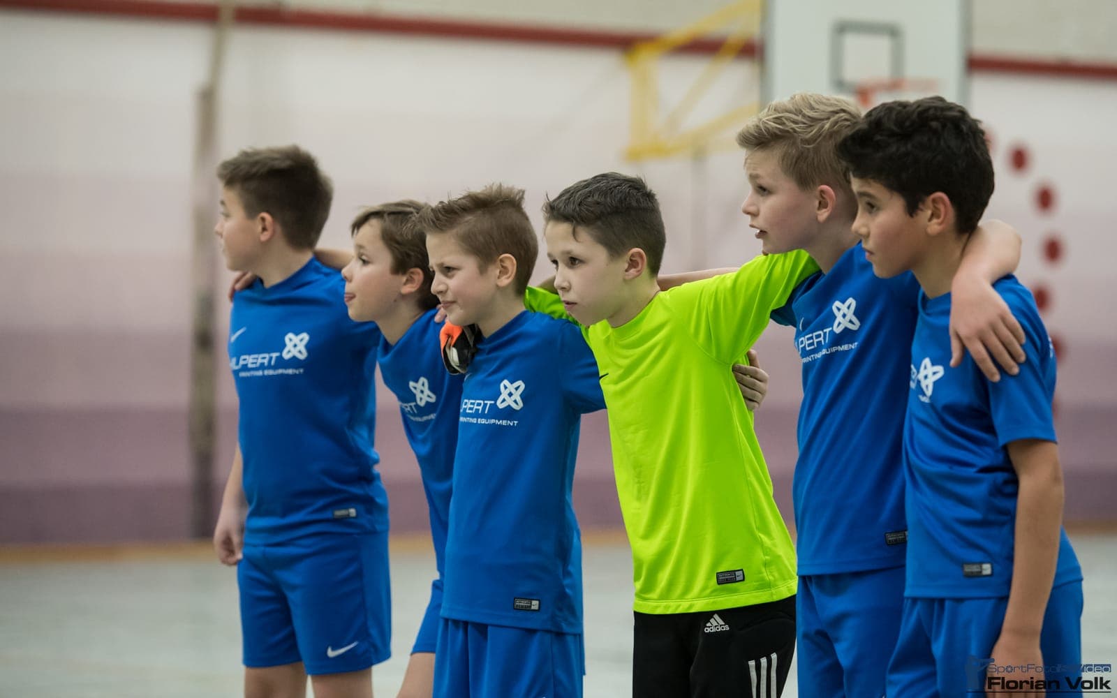 German youth indoor football — players and ball in action