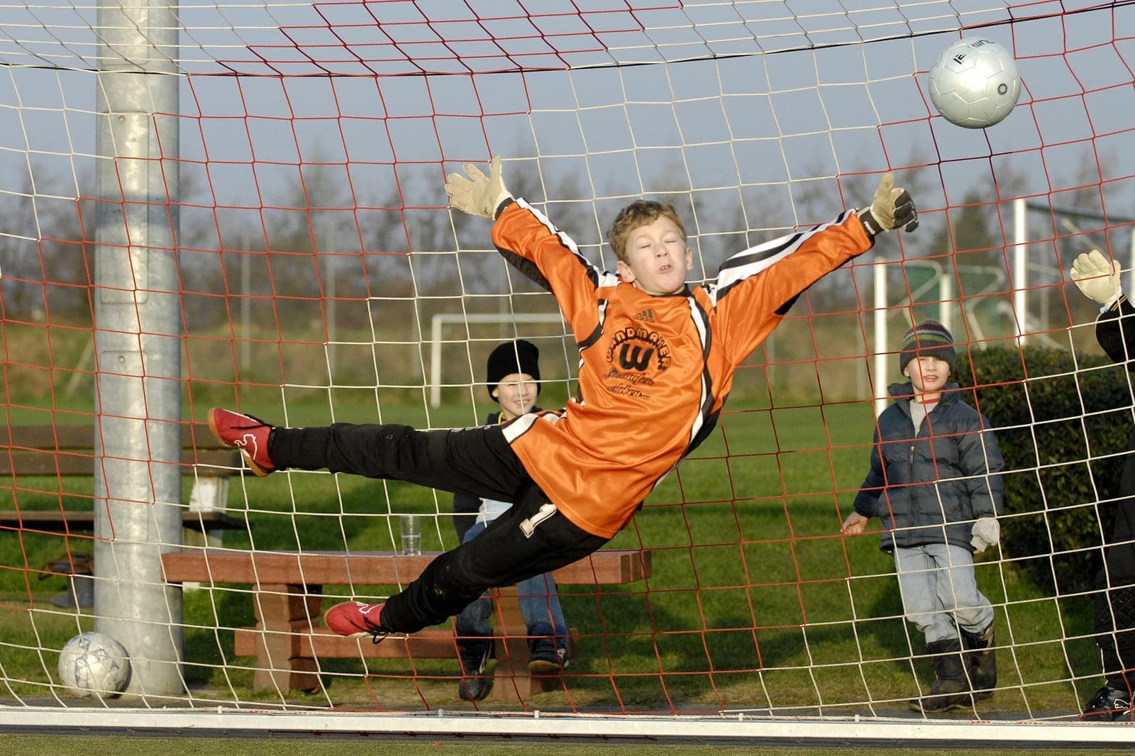 German youth goalkeeper in action — ball visible