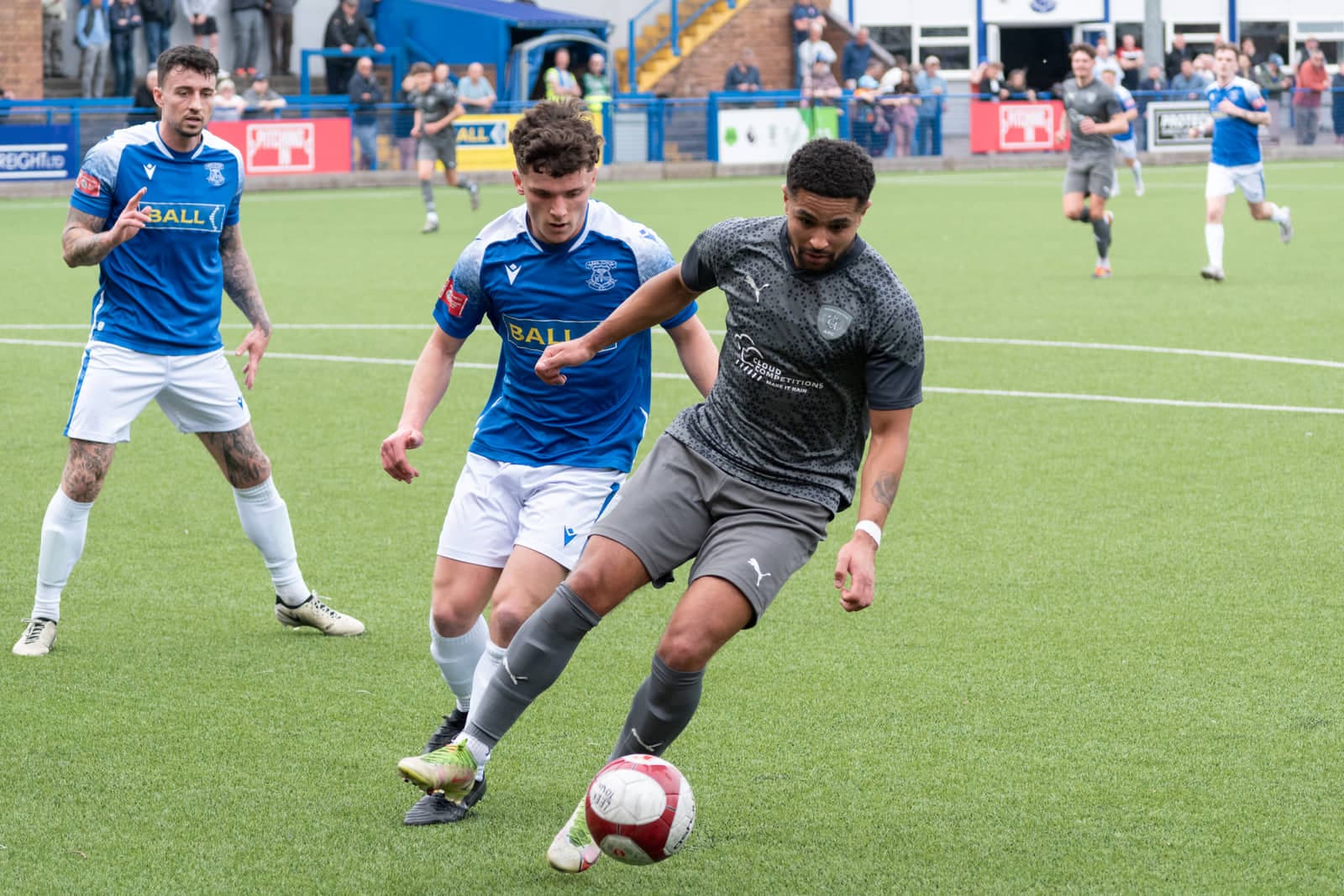 Leek Town versus Workington non‑league match action with players and ball