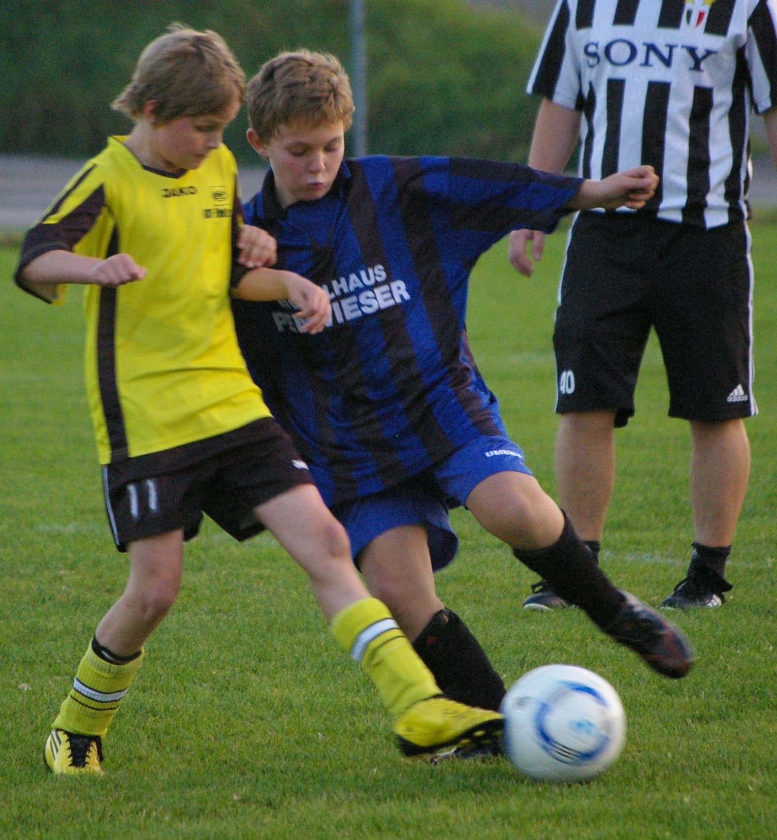 Youth footballer dribbling with the ball